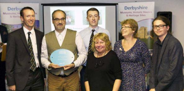 Volunteers and staff with the award