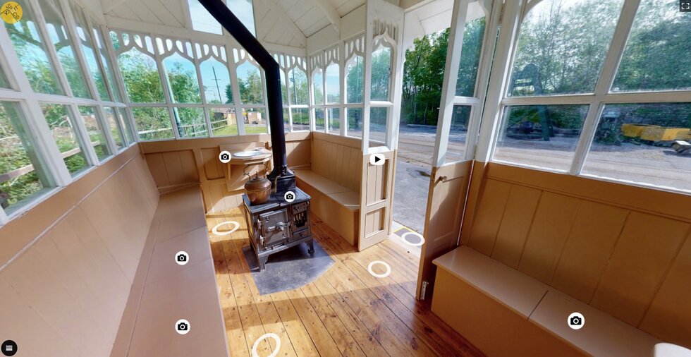 A photo of the interior of the restored cabmen's shelter showing the stove and wash basin.