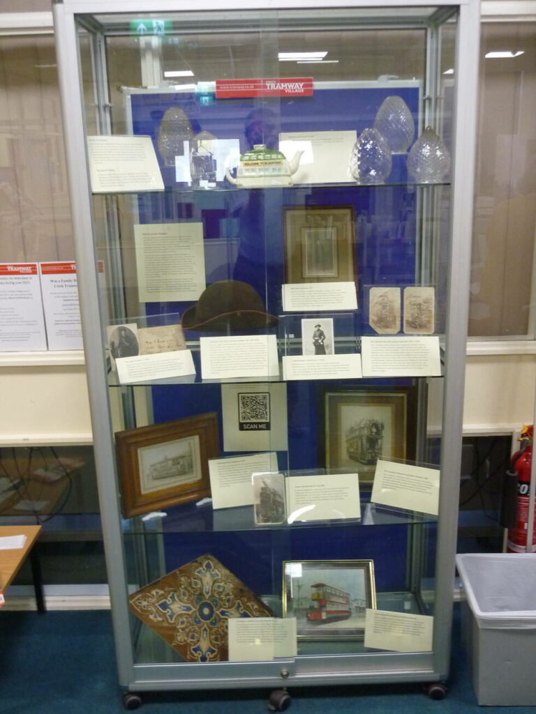 Tram related objects in a display case.