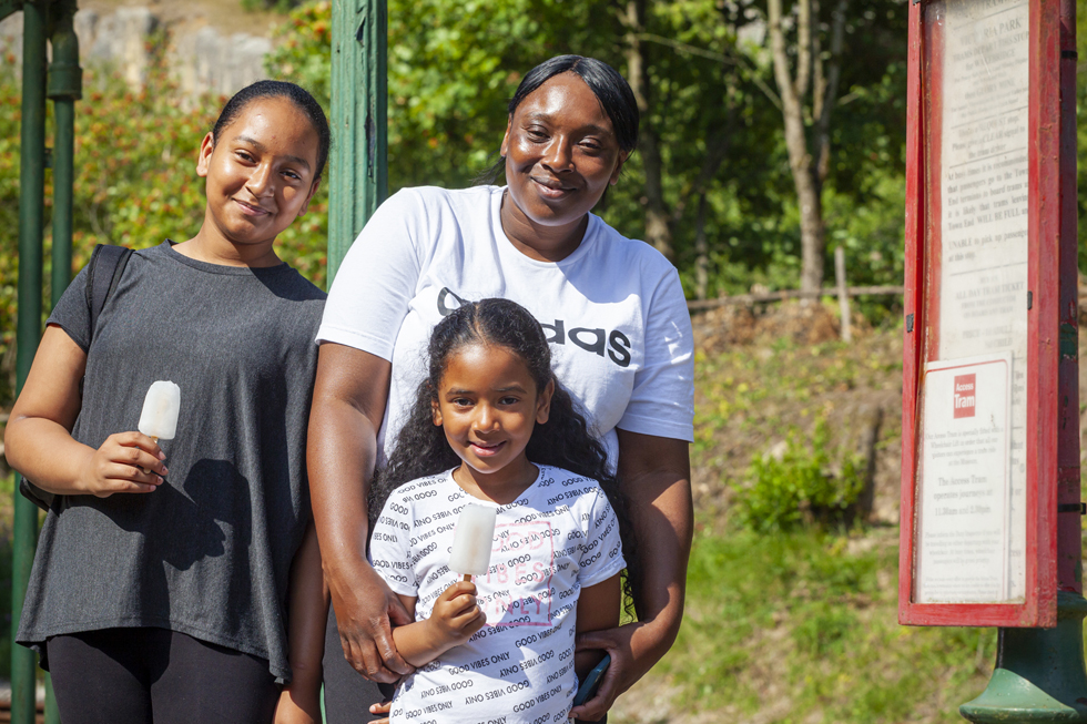 Family at tram stop