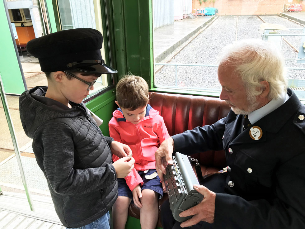 Cam and EJ learn about tram conductors with Ron 