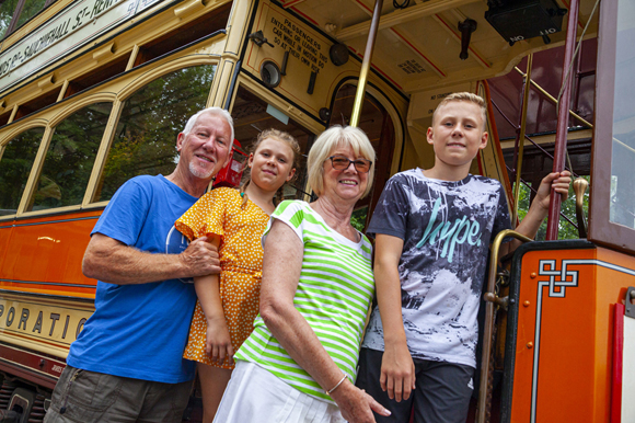 Family about to board a tram -